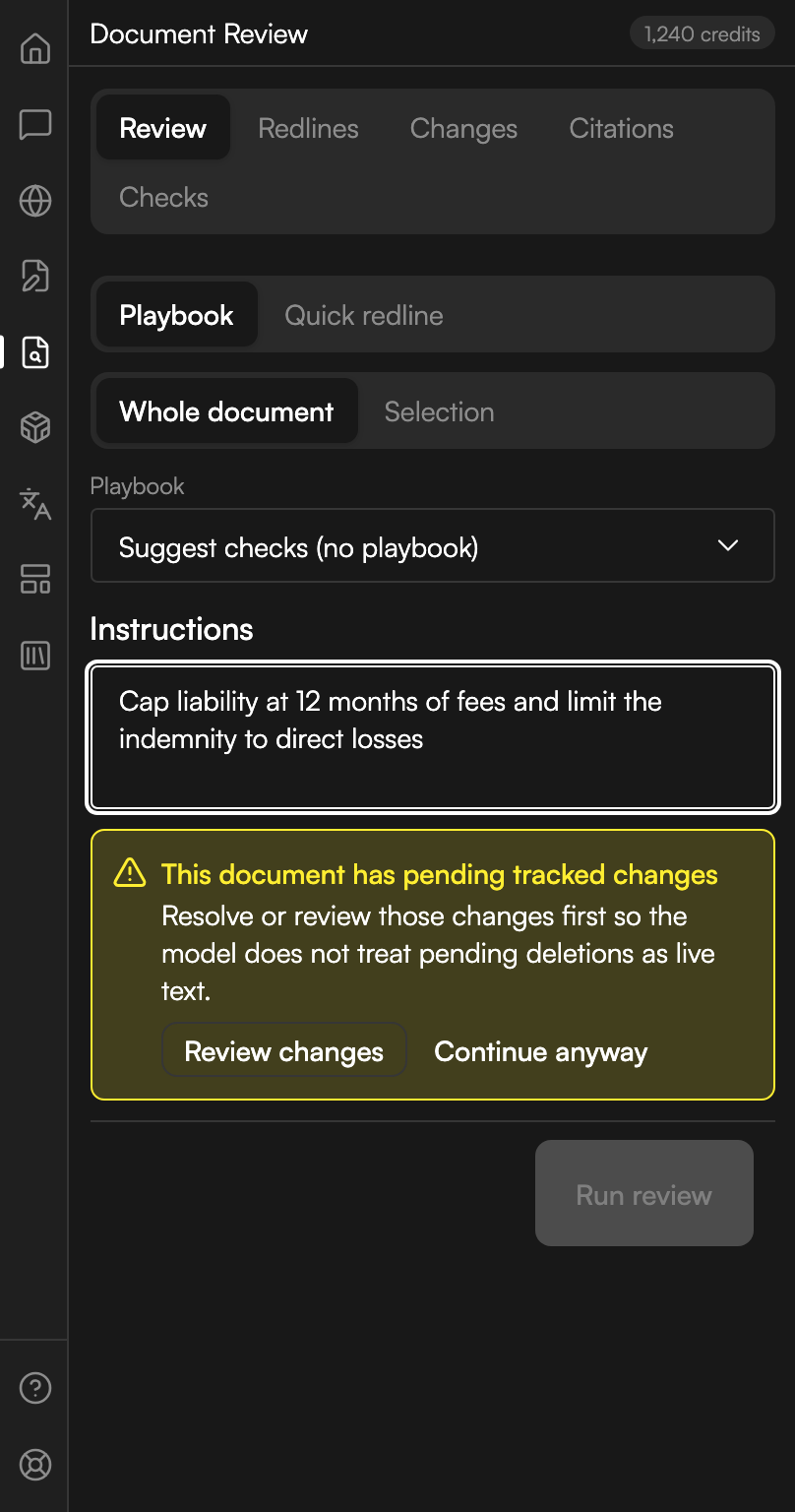 The Review tab of Document Review. Two segmented controls read Playbook and Quick redline, and Whole document and Selection, with Playbook and Whole document chosen. A playbook dropdown reads Suggest checks (no playbook). An Instructions box holds a typed instruction about capping liability and narrowing the indemnity. A yellow warning below says the document has pending tracked changes and offers Review changes and Continue anyway, and the Run review button beneath it is greyed out.