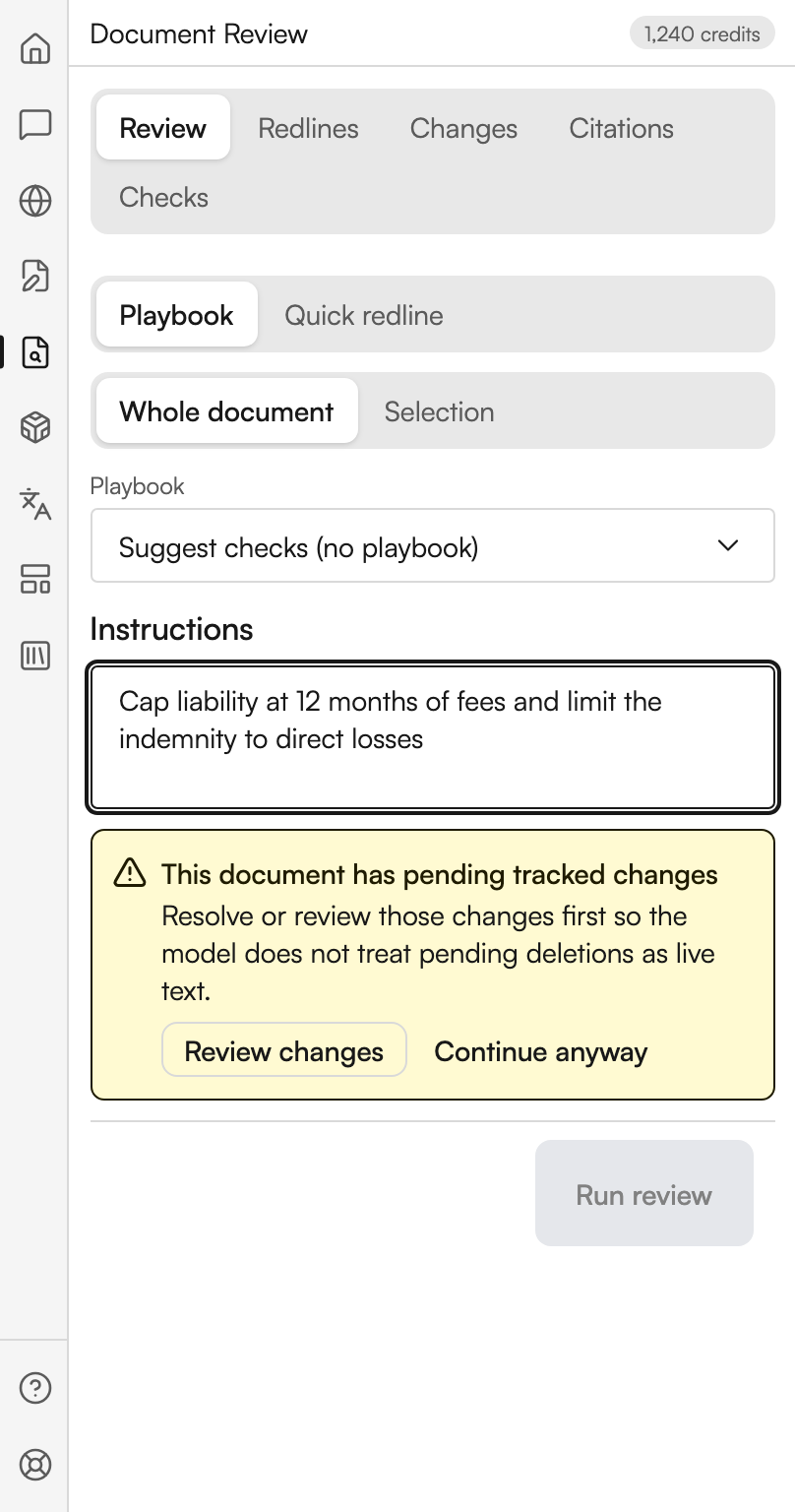 The Review tab of Document Review. Two segmented controls read Playbook and Quick redline, and Whole document and Selection, with Playbook and Whole document chosen. A playbook dropdown reads Suggest checks (no playbook). An Instructions box holds a typed instruction about capping liability and narrowing the indemnity. A yellow warning below says the document has pending tracked changes and offers Review changes and Continue anyway, and the Run review button beneath it is greyed out.